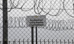 FILE - In this file photo dated Monday, April 8, 2019, a sign reading: “State Border” is attached to a fence at Hungary’s border with Serbia near the village Asotthalom, Hungary. The European Union’s border control agency Frontex, said Wednesday Jan. 27, 2021, it is suspending operations in Hungary after the government in Budapest did not comply with a ruling by Europe’s highest court on the rights of asylum-seekers. (AP Photo/Darko Vojinovic, FILE)