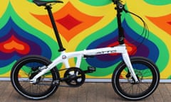 AC Atto folding bike parked in front of a painted wall