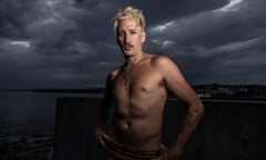 Kirin J Callinan shirtless with dark clouds in background