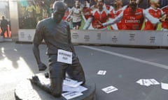 A sign attached to Thierry Henry’s statue reads ‘Kroenke out’ at Arsenal’s Emirates Stadium.