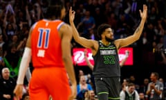 Karl-Anthony Towns of the Minnesota Timberwolves celebrates a basket by teammate Rudy Gobert on Friday night.