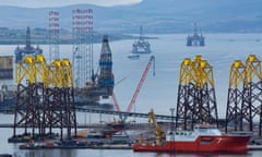 Yellow and black offshore wind turbine towers in  Cromarty Firth