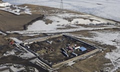 FILE - This Feb. 13, 2017, aerial file photo shows a site where the final phase of the Dakota Access Pipeline near the Missouri River took place with boring equipment routing the pipeline underground and across Lake Oahe to connect with the existing pipeline in Emmons County in Cannon Ball, N.D. The developer of the Dakota Access oil pipeline missed a year-end deadline to plant thousands of trees along the pipeline corridor in North Dakota, but the company said it was still complying with a settlement of allegations it violated state rules during construction. (Tom Stromme/The Bismarck Tribune via AP, File)