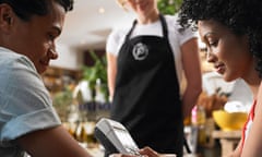 Couple and Waitress in Cafe