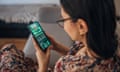 Stock image of a woman gambling using her mobile phone