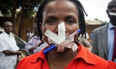 A Ugandan woman takes part in a protest in Kampala after police raided several media outlets in 2013. 