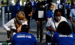 FILES-US-ECONOMY-UNEMPLOYMENT-INDICATOR<br>(FILES) In this file photo taken on September 09, 2021, people receive information as they attend a job fair for employment with SoFi Stadium and Los Angeles International Airport employers, at SoFi Stadium in Inglewood, California. - New applications for US unemployment benefits dipped below 300,000 last week for the first time since Covid-19 sent them skyrocketing into the millions last year, according to data released by the Labor Department on October 14, 2021. (Photo by Patrick T. FALLON / AFP) (Photo by PATRICK T. FALLON/AFP via Getty Images)