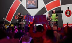 The view from the crowd at Alexandra Palace as Michael van Gerwen celebrates his victory against Dirk van Duijvenbode at the 2023 world championships.