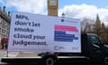 A campaign sign by Cancer Research UK outside parliament on 16 April.