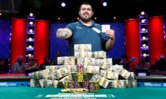 Scott Blumstein poses with his championship bracelet and cards after winning the World Series of Poker main event in Las Vegas