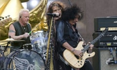 Joey Kramer performing with singer Steven Tyler and guitarist Joe Perry