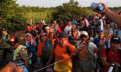 Migrants, part of a caravan traveling from Central America en route to the United States walk by the road that links Ciudad Hidalgo with Tapachula<br>Migrants, part of a caravan traveling from Central America en route to the United States ask for supplies while walking by the road that links Ciudad Hidalgo with Tapachula, Mexico, November 2, 2018. REUTERS/Carlos Garcia Rawlins