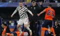 Ole Gunnar Solskjær looks on as Luke Shaw tries to escape two opposing players during the match.