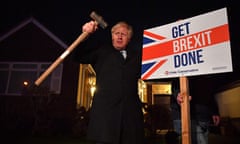 Boris Johnson poses after hammering a “Get Brexit Done” sign into the garden of a supporter
