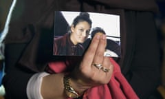 A family member holding a photo of Shamima Begum in February 2015