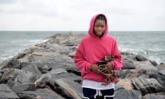 Mary Maxwell on her way to a cross erected on the breakwaters to pray.