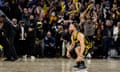 Golden State Warriors guard Stephen Curry reacts after hitting a three-point shot in the last second against the Phoenix Suns at Chase Center on Saturday night.