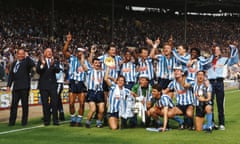 The Coventry City squad celebrate with the trophy.