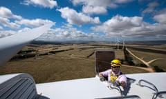 Sturt Daley, site manager, emerges at the top of a wind turbine at Capital Wind Farm in Bungendore, Australia, on Wednesday, Dec. 22, 2010. The wind farm comprises 67 2.1MW wind turbines with a total installed capacity of 140.7MW, which is equivalent to providing the energy needs of approximately 60,000 homes. The electricity generated at the Capital Wind Farm is fed directly into the TransGrid network via an onsite substation, with the majority of output going on to supply the Sydney Desalination Plant at Kurnell. Photographer: Ian Waldie/Bloomberg via Getty Images *** Local Caption *** Sturt Daley  ozstock