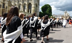 A parade of students from Newnham at Cambridge University pass by Kings college on their way to graduation at the Senate House<br>G99YFJ A parade of students from Newnham at Cambridge University pass by Kings college on their way to graduation at the Senate House