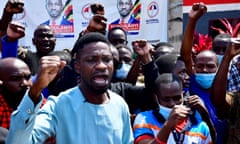 Former presidential candidate Robert Kyagulanyi, also known as Bobi Wine, gestures as he speaks during a news event after members of his security detail were released on bail, at his party's headquarters in Kampala, Uganda