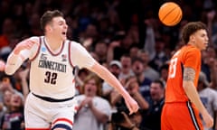 Donovan Clingan of the Connecticut Huskies celebrates a basket against the Illinois Fighting Illini during the second half of Saturday’s Elite Eight showdown in Boston.