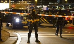 Dutch policemen stand guard by a cordoned off area outside Amsterdam’s Schiphol Airport late on April 12, 2016, after it was partially evacuated following a security alert, and a person was one arrested, according to official sources. / AFP PHOTO / ANP / Michel van Bergen / Netherlands OUTMICHEL VAN BERGEN/AFP/Getty Images