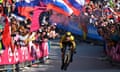 Primoz Roglic rides to stage 20 victory with his Slovenian colours flying in the crowd.