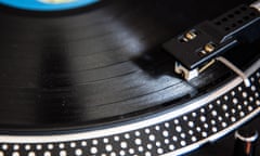 British Record Shops See A Vinyl Revival<br>BRISTOL, ENGLAND - OCTOBER 14:  A record dealer in Wanted Records in St Nicholas Market puts on a vinyl record on the shop's turntable on October 14, 2015 in Bristol, England. Although sales of vinyl records declined dramatically with the introduction of digital formats such as CDs and downloads it is now seen as a premium product and sales this year in the UK of newly pressed LP records on vinyl are expected to top 2million double what they were in 2014.  (Photo by Matt Cardy/Getty Images)