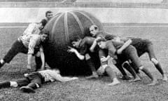 A Game of 'Pushball', Crystal Palace, 1902.<br>Photograph showing a game of 'pushball' between Anerley and Crystal Palace at the Crystal Palace sports ground, 4th October 1902. This match, one of the first played in Britain of this American game, was won by Anerley by 1 goal and 3 tries. The ball itself weighed 50lb. Date: 1902