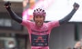 Egan Bernal makes a point to cross the line in Cortina with his pink jersey on display.