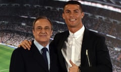 (FILES) This file photo taken on November 7, 2016 shows Real Madrid's Portuguese forward Cristiano Ronaldo (R) and club president Florentino Perez posing during the official presentation of Ronaldo's contract renewal, in the presidential box at the Santiago Bernabeu stadium in Madrid. Florentino Perez's first task after being re-elected unopposed as Real Madrid president will be to appease superstar Cristiano Ronaldo amid speculation the four-time world player of the year wants to leave. / AFP PHOTO / GERARD JULIENGERARD JULIEN/AFP/Getty Images