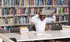 African Male Student Throwing Laptop And Want To Destroy It - Shallow Depth Of Field<br>EWT9XH African Male Student Throwing Laptop And Want To Destroy It - Shallow Depth Of Field