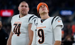 Cincinnati Bengals quarterback Joe Burrow, right, looks on from the sideline during the second half of Thursday’s game against the Ravens in Baltimore.