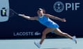 Simona Halep stretches to attempt a forehand against Paula Badosa.