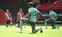 Players take a knee before a Premier League game between Everton and Southampton in October 2020.