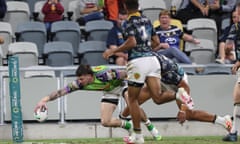 Curtis Scott fended off the Cowboys’ Murray Taulagi to score as the Raiders won in Townsville