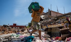 Morocco's Earthquake Leaves Villages With Dim Hopes Of Rebuilding<br>OUIRGANE, MOROCCO - SEPTEMBER 16: A boy carries a box of intact dishware found in the rubble in the village of Imzalin on September 16, 2023 in Ouirgane, Morocco. Nearly 3,000 people were killed when a 6.8-magnitude earthquake struck south of Marrakech on September 8th. (Photo by Alexi Rosenfeld/Getty Images)