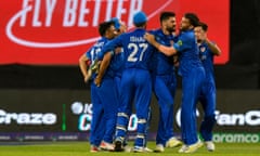 Afghanistan's Naveen-ul-Haq celebrates the dismissal of Bangladesh's vice-captain Taskin Ahmed