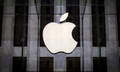 An Apple logo hangs above the entrance to the Apple store on 5th Avenue in the Manhattan borough of New York City.