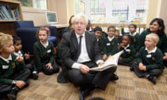 Boris Johnson reads to children as he opens the South Ruislip Library in London in September 2012. 