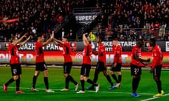 FBL-FRA-LIGUE1-RENNES-LYON<br>Rennes players celebrate a goal during the French L1 football match between Rennes (Stade Rennais) and Lyon (Olympique Lyonnais) at the Roazhon Park stadium in Rennes, on November 7, 2021. (Photo by Sameer Al-DOUMY / AFP) (Photo by SAMEER AL-DOUMY/AFP via Getty Images)