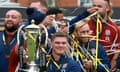 Captain Owen Farrell and teammates show off the Six Nations trophy.