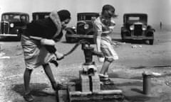 Image of children pumping water