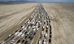 Vehicles are seen departing the Burning Man festival in Black Rock City, Nevada.