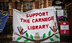 A banner hangs outside Carnegie Library, which has been occupied by protesters.