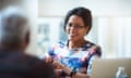 Smiling businesswomen discussing a project with a colleague in a casual stylish office