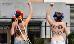 BELGIUM-UKRAINE-WOMEN-RIGHTS-FEMEN<br>Activists from the feminist movement Femen demomstrate in front of the Ukrainian ambassy in Brussels on August 29, 2013 against alleged wiretapping at the groups headquarters in Kiev. The group, known for its topless political protests, is facing a criminal probe for possession of illegal weapons after police searched its offices in central Kiev on Tuesday.
AFP PHOTO GEORGES GOBET        (Photo credit should read GEORGES GOBET/AFP/Getty Images)