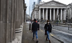 people walk past the Bank of England