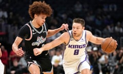 Jason Preston (left) goes up against Matthew Dellavedova during one of his appearances for the Clippers last season